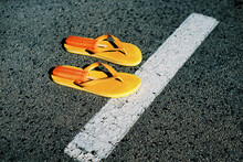 popsicles on a pair of flip-flops on the street, 35mm