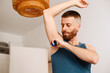 © Lucas Ottone/Stocksy - Man applying deodorant on his armpit