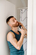© Lucas Ottone/Stocksy - Man at home trimming his beard