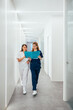 © VICTOR TORRES/Stocksy - Female doctors checking papers in clinic.