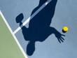 © Raymond Forbes LLC/Stocksy - Pickleball court with shadow of  plus size player reaching for ball