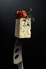 Wall Mural - Blue cheese on a knife.