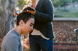 © ByLorena/Stocksy - Teenager shaving hair outdoors