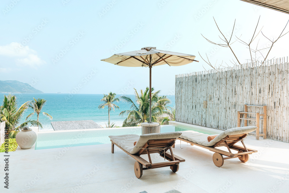Chaise lounge umbrella and private swimming pool Stock Photo | Adobe Stock