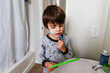 © Maria Manco/Stocksy - Boy pretends to shave his face