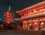 Fototapeta Mosty linowy / wiszący - Night scenery of Historical landmark The Senso-Ji Temple in Asakusa, Tokyo, Japan. Japanese wordings on the architecture means 
