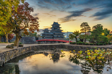 Wall Mural - Matsumoto Nagano Japan, sunrise city skyline at Matsumoto Castle with autumn foliage season