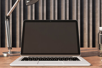 Poster - Close up of contemporary wooden designer office desktop with empty mock up laptop screen and other items. Decorative wall in the background. 3D Rendering.