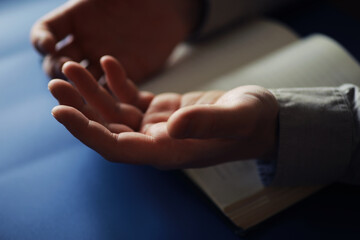 Wall Mural - Reading religious literature. Open book. Man reads bible or Koran.