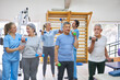 © Robert Kneschke - Physiotherapists assisting elderly people exercising at rehabilitation center
