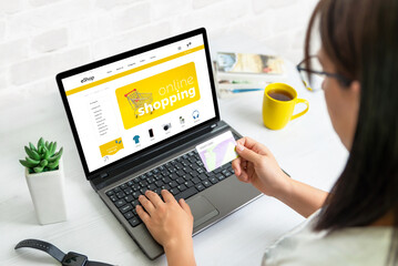 Wall Mural - woman use credit card to shopping online with laptop on ecommerce web site