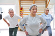 © Robert Kneschke - Happy senior males and females exercising at rehab center