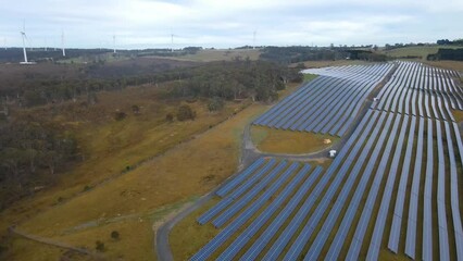 Wall Mural - aerial drone view of a hybrid wind and solar farm for renewable clean energy supply located at banni