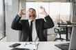 © Serhii - Angry businessman with document shouting at somebody