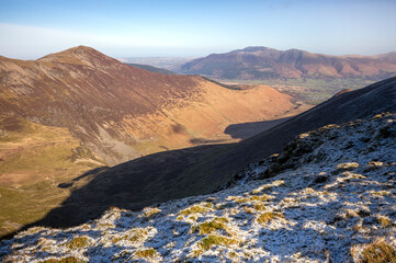 Sticker - Views of Grisedale Pike above Coledale Beck with Skiddaw in the distance in winter in the English Lake District, UK.