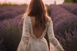 © Canvas Alchemy - Young pretty woman standing back on the lavender field