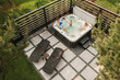 Top view of a family relaxing in an outdoor hot tub in summer