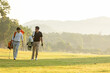 © freebird7977 - Group golf professional Golfer asian man walking in fairway with bag golf at golf  club.  Hobby in holiday and vacation with friends.  Lifestyle and Sport Concept