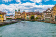 Nice upriver view of the Needle Dam or Reuss Weir and the Jesuit Church (Jesuitenkirche St. Francis Xavier) at the Reuss riverfront in Lucerne's famous Old Town.