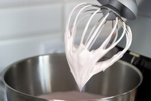 Stainless Steel Pot And Whisk With Whipped Cream