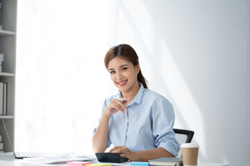 Aufkleber - Young serious accountant working for her client, focusing on her work at office desk.