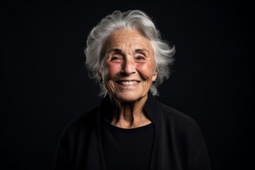 Wall Mural - Headshot portrait photography of a happy old woman giving a hug to the camera against a dark grey background. With generative AI technology