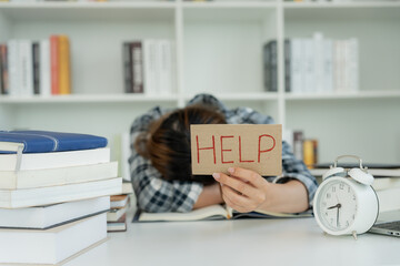 Asian student woman have anxiety because of exams, female prepare for test and learning lessons in the library. stress, despair, haste, misunderstanding reading, discouraged, expectation, knowledge