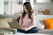 young asian professional woman freelancer working at home