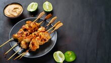 Grilled Chicken Skewers Served With Peanut Dipping Sauce. Chicken Satay With Peanut Sauce. Tasty Meal For Dinner Or Party Appetizers. Dark Background With Free Text Space. Generative Ai