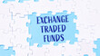 © Алла Морозова - Puzzles on a blue background with the inscription Exchange Traded Funds