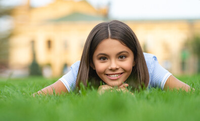 photo of happy girl relax at summer lawn with grass outdoor