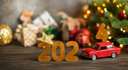 Wooden numbers 2024, toy car carries the number 4