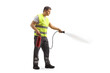 Man in a reflective safety vest using a fire extingushier