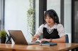 © chartchai - Asian girl student online learning class study online video call zoom teacher, Happy asian girl learn english language online with computer laptop...