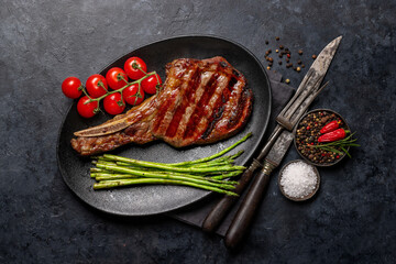 Sticker - Medium rare grilled Tomahawk beef steak with asparagus