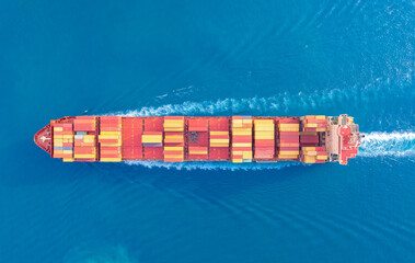 Top viewContainer ship loading and unloading in sea port, Aerial view of business logistic import and export freight transportation  container ship in harbor, Container loading Cargo  ship, Dubai