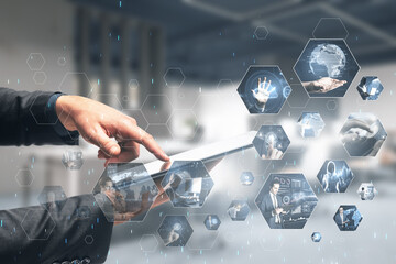 Aufkleber - Connecting businesspeople, technology, metaverse and video conference concept. Close up of businessman hands using tablet with creative hexagonal images on blurry office interior background.