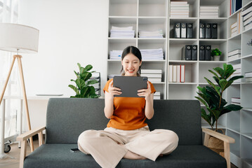 Asian woman hands using smartphone and holding credit card sitting. Online Shopping payments concept.