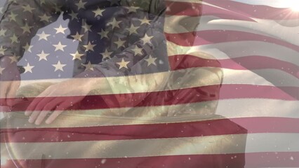 Poster - Animation of waving flag of america over caucasian soldier packing bag against white background