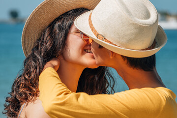 Wall Mural - couple in love kissing on the beach