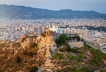 Wall Mural - Aerial view of the top of Lycabettos Hill, Athens, Greece, with numerous tourist enjoying the summer sunset over the city skyline