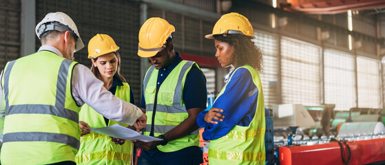 Wall Mural - Engineers or foreman inspecting and check up machine at factory machines. Worker industry working in the metal sheet company.