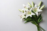 Fototapeta Tulipany - White lily flowers sitting on top of a table. Generative AI. Copy space, place for text, copyspace.