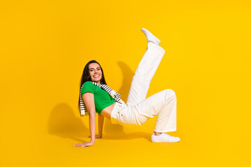 Poster - Full length photo of adorable excited lady wear white pants dancing having fun isolated yellow color background