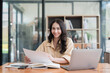 © itchaznong - Accountant woman working on laptop and do document, tax, exchange, research, accounting and Financial advisor concept