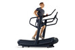 Full length of a fitness sporty man running or walking on a treadmill PNG transparent photo. Young male athlete in sportswear running on a professional treadmill in gym