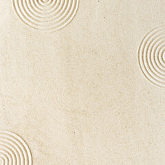 Top view pattern in Japanese Zen Garden with close up concentric circles on sand for meditation and relaxation. Aesthetic minimal sand background with copyspace, beige neutral tones.