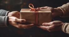 Hands Holding A Brown Paper Gift Box , Christmas Presents