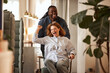 © Flamingo Images - Businesswoman being pushed in a chair and cheering