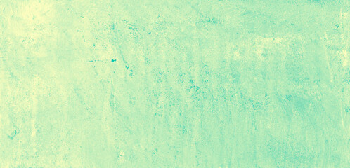 Yellow speckled hand-painted illustration texture design of old distressed vintage grunge concrete with green stains. damaged textured abstract washed cement backdrop as web banner background.